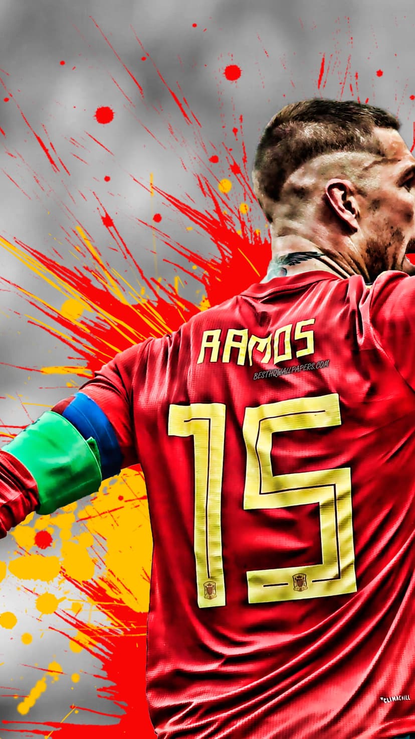 Sergio Ramos in a number 15 Spain jersey surrounded by red and yellow paint splatters on a textured grey surface.