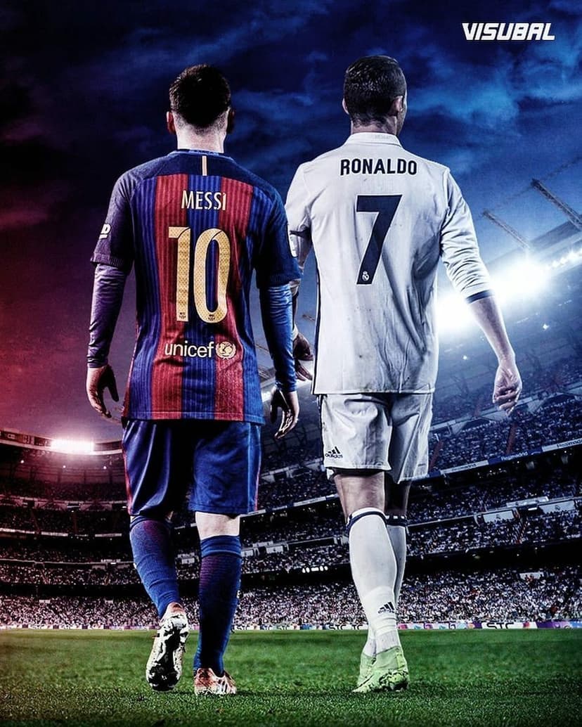 Lionel Messi and Cristiano Ronaldo walk side by side on a soccer field wearing their classic club jerseys at dusk.
