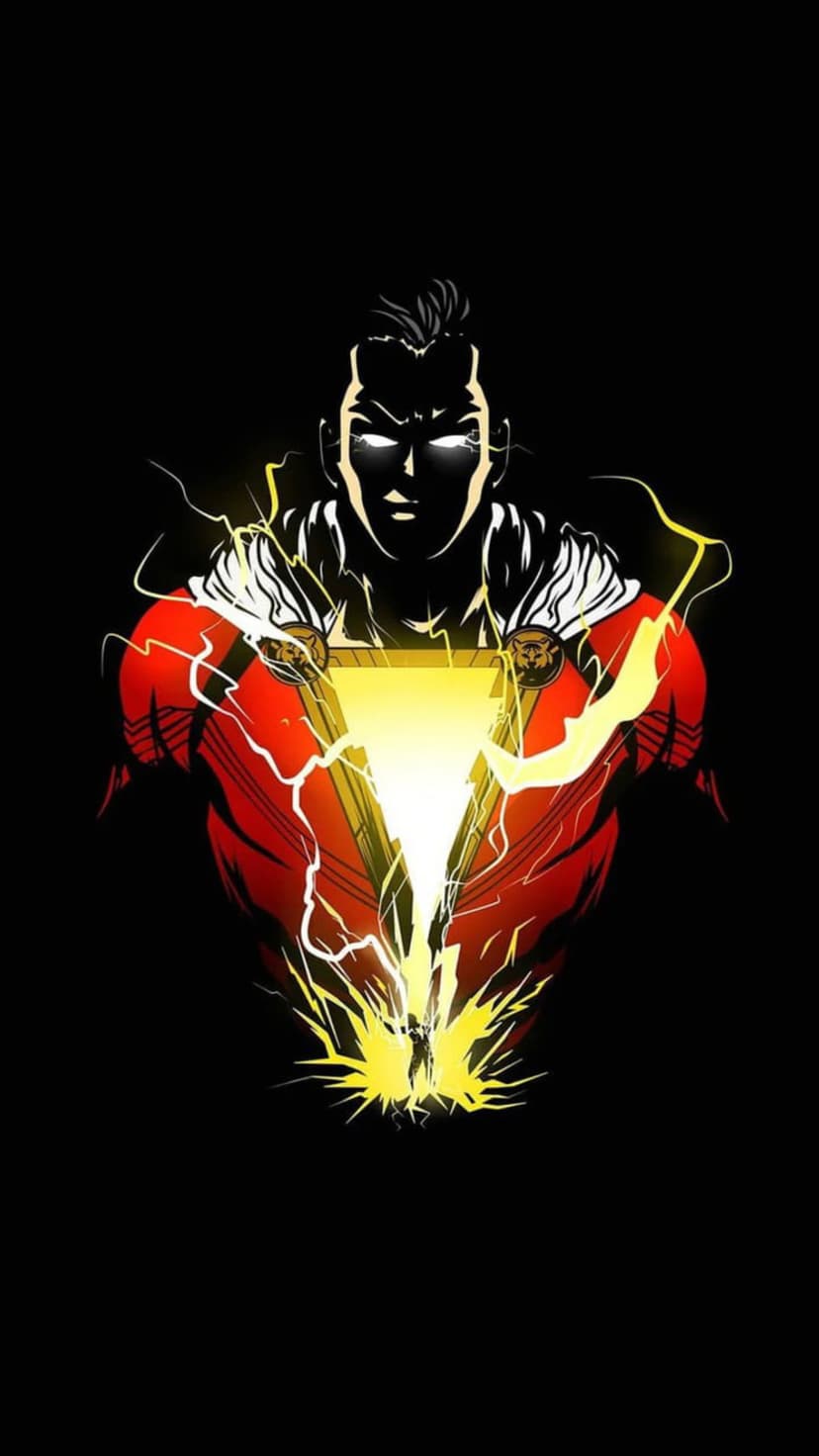 Shazam faces forward with glowing eyes as yellow lightning surges from his chest emblem against a dark background.