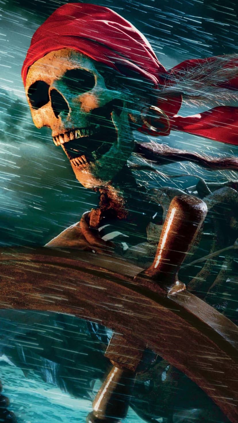 Skeleton pirate captain with a red bandana grips a wooden ship wheel amid crashing waves and rain spray.