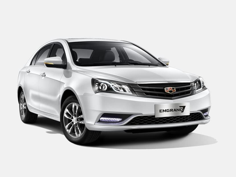 White Geely Emgrand 7 sedan from a front-three-quarter angle against a solid white studio background with soft shadows.