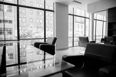 Modern office waiting area with large windows