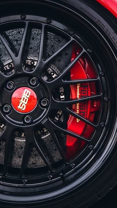 Red Brembo Brake Detail on Black BBS Alloy Phone Backdrop