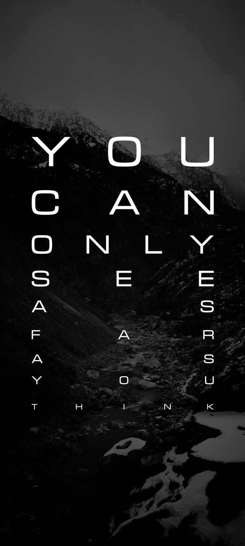 White vertical text spelling YOU ONLY SEE AS YOU THINK overlays a dark, craggy mountain peak in monochrome.