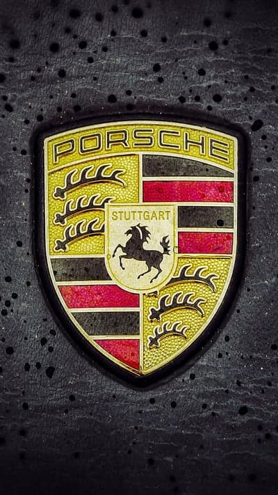 Luxury Porsche Crest Phone Background on Dark Texture