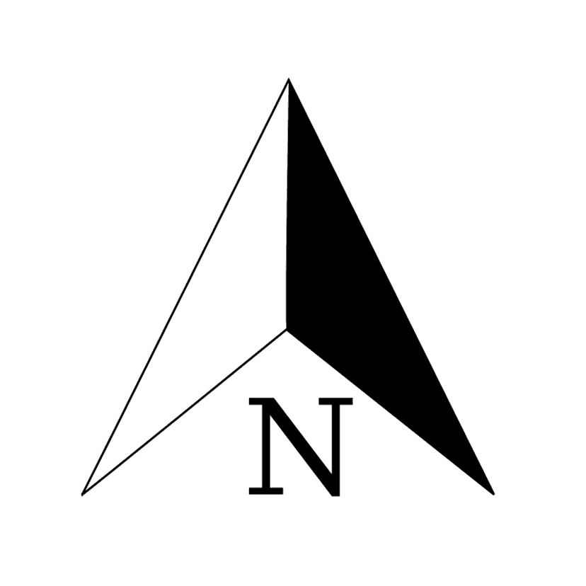 North arrow compass rose symbol featuring bold black lines and a circular frame on a white background.
