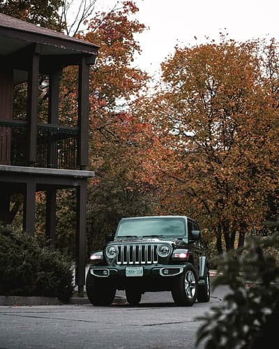 Dark Green Jeep Wrangler Fall Foliage Phone Wallpaper