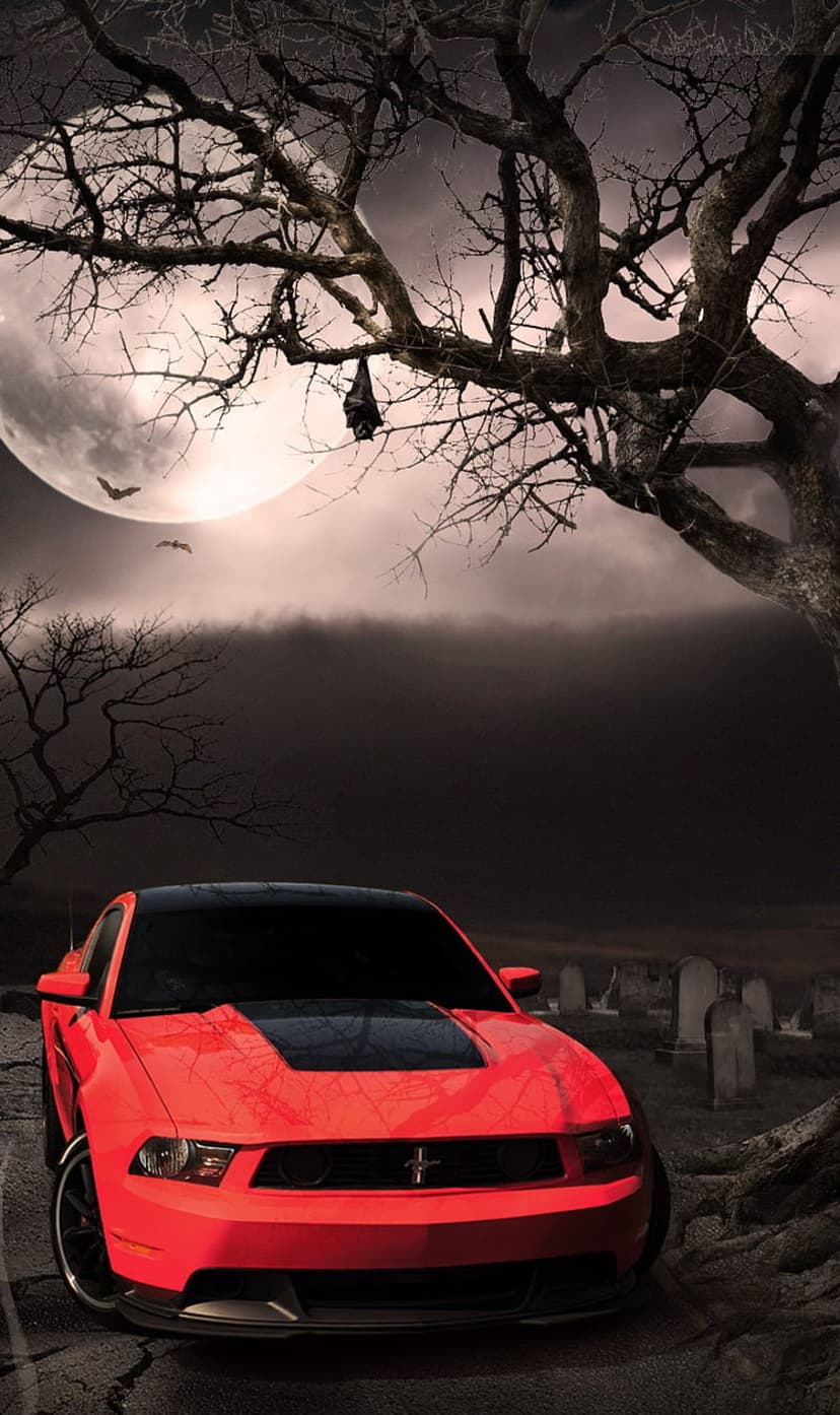 Red Mustang car parked on a cracked road in a graveyard under a large full moon with bats and dead trees.