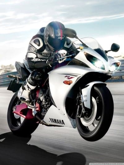Yamaha R1 Motorcycle Racer in Action on Track