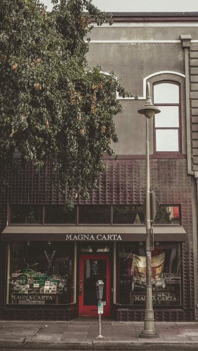 Magna Carta store with vintage bike and red door
