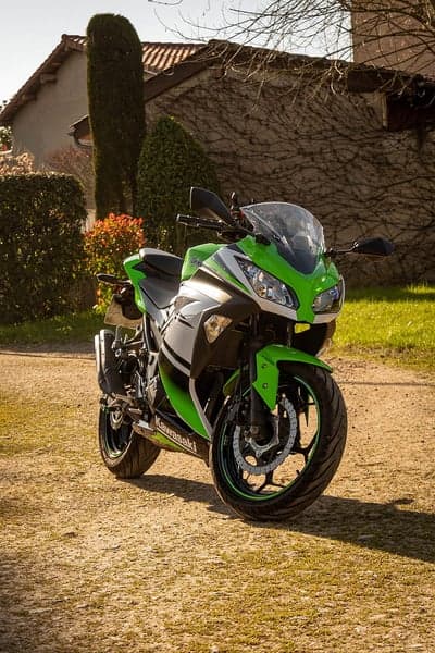 Green Kawasaki Ninja Sportbike Rustic Road Phone Wallpaper