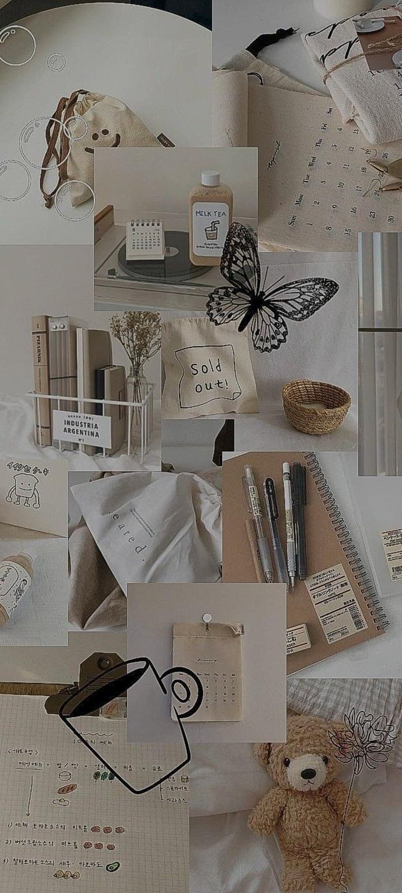 Stacked books, a plush teddy bear, and a small butterfly arranged on a beige surface with handwritten study notes.