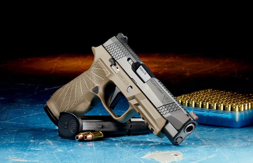 SIG Sauer P320 pistol in tan and black finishes on a blue surface with a loaded magazine and brass ammunition.