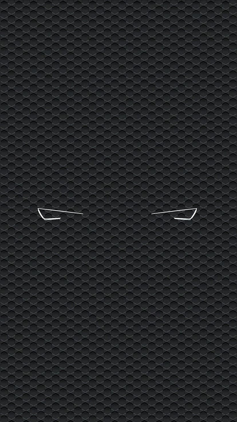 Angular white lines forming eyes contrast against a dark black hexagonal honeycomb textured background.