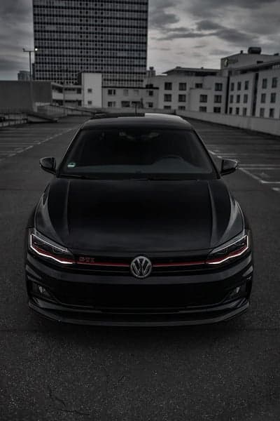 Sleek Black VW Polo GTI in Urban Parking Lot