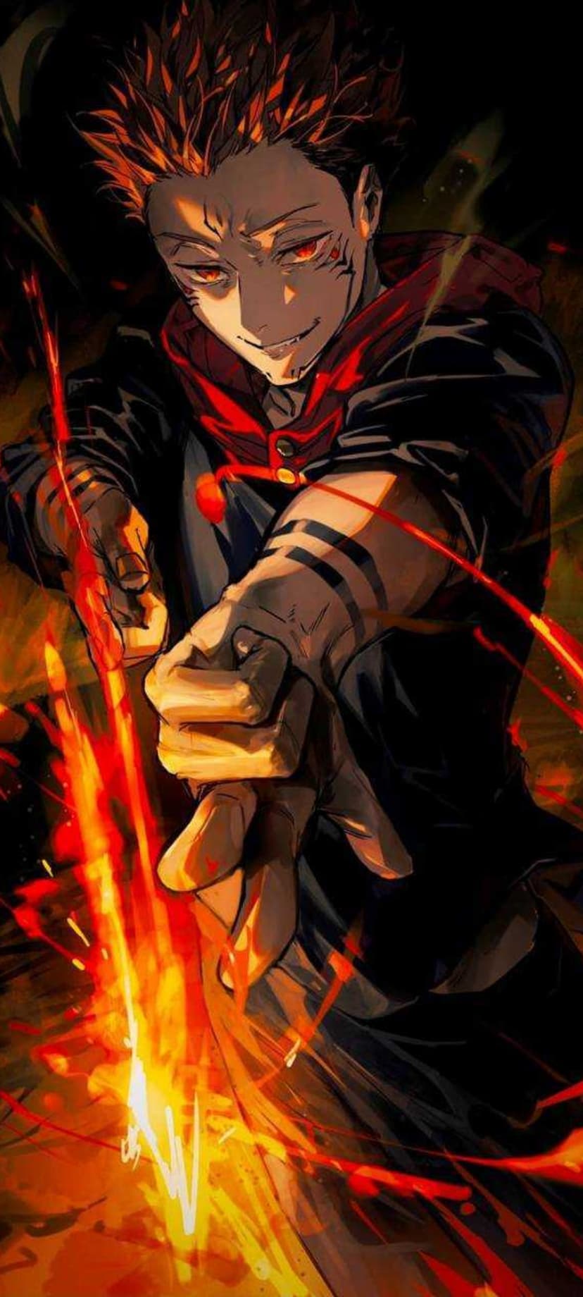 Ryomen Sukuna grins while holding orange flames, wearing a black jacket with a red hood and facial markings.
