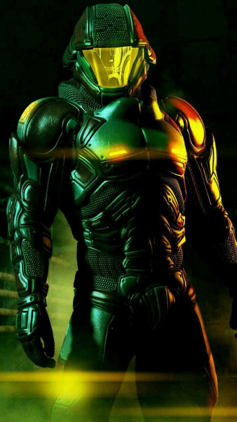 Armored soldier in dark green plating stands with a glowing yellow helmet visor and textured mechanical details.