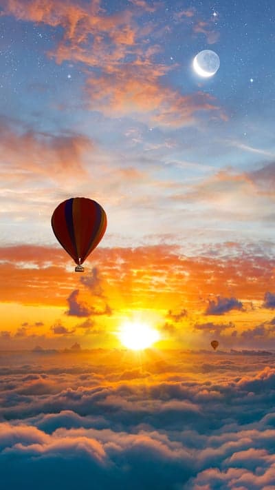 Skies Ablaze - Balloons Over a Cloud Sea at Dawn
