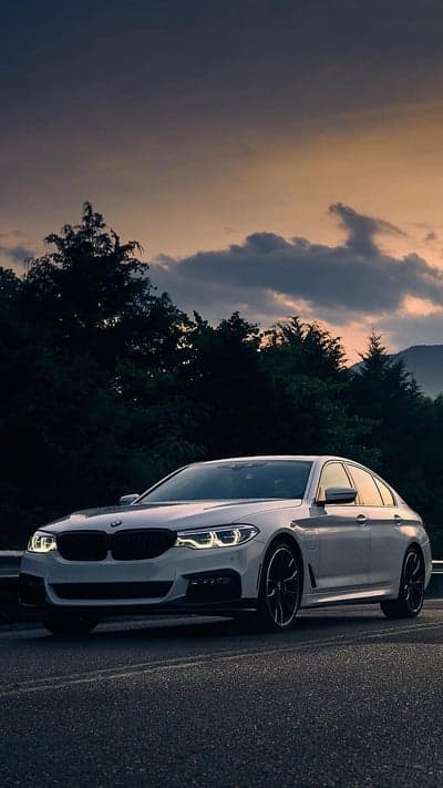 BMW Luxury Sedan Sunset Scenic Road Mobile Wallpaper