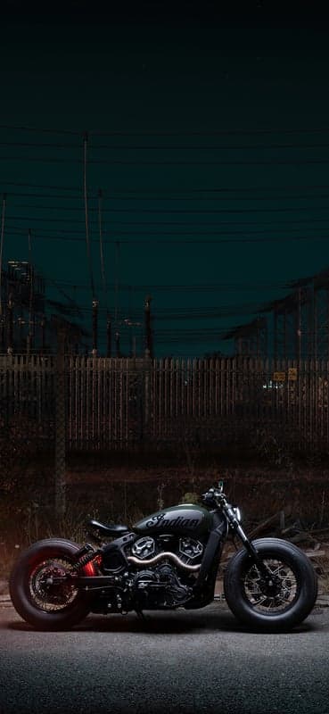 Dark Indian Motorcycle at Night by Power Lines