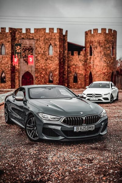 Luxury Cars Parked at Ancient Castle