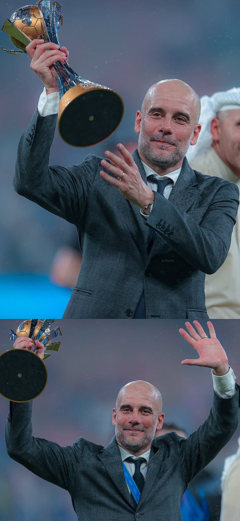Pep Guardiola lifts a silver football trophy high above his head during a stadium victory celebration.