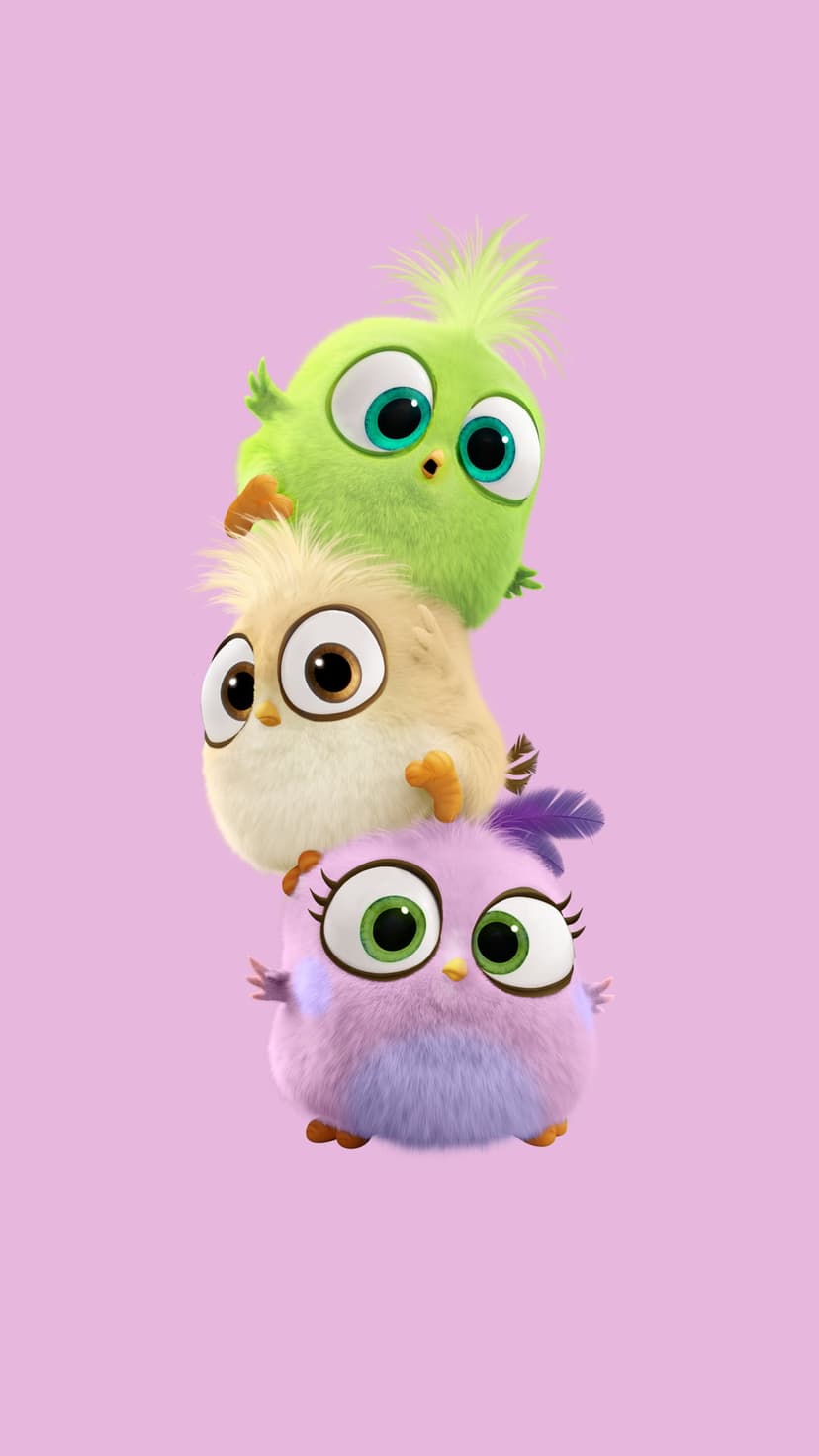 Three round hatchlings in green, yellow, and purple stack vertically on a solid soft pink background.