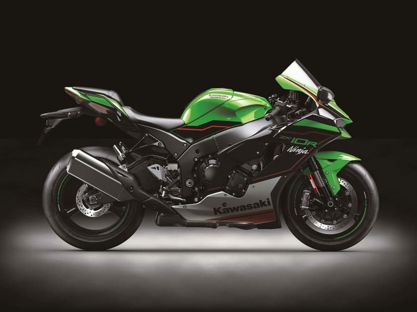 Profile view of a lime green and black Kawasaki Ninja ZX-10R sport bike against a dark studio background.