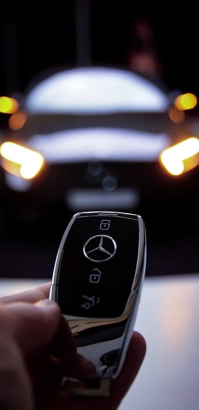 Luxury Mercedes Key Fob and Glowing Headlights Wallpaper