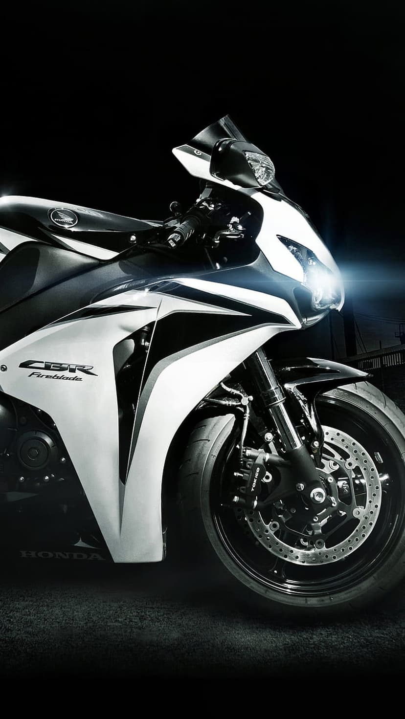 Honda CBR Fireblade sportbike with aerodynamic fairings and metallic finish showcased in a vertical portrait view.