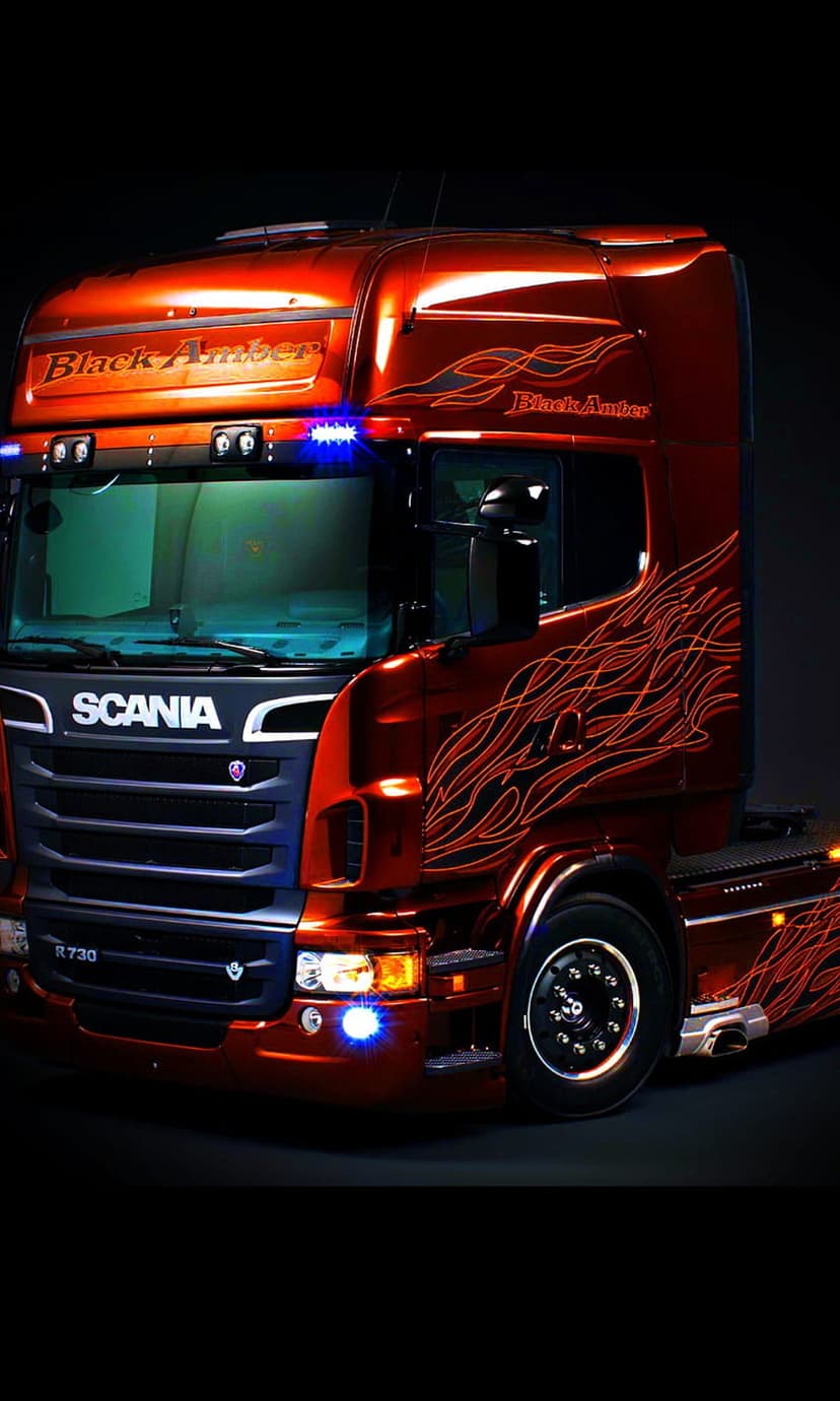 Scania R730 Black Amber truck with orange flame graphics and blue LED lighting on a customized chassis.