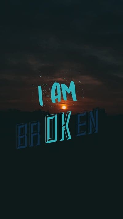 I AM BROKEN typography over sunset sky