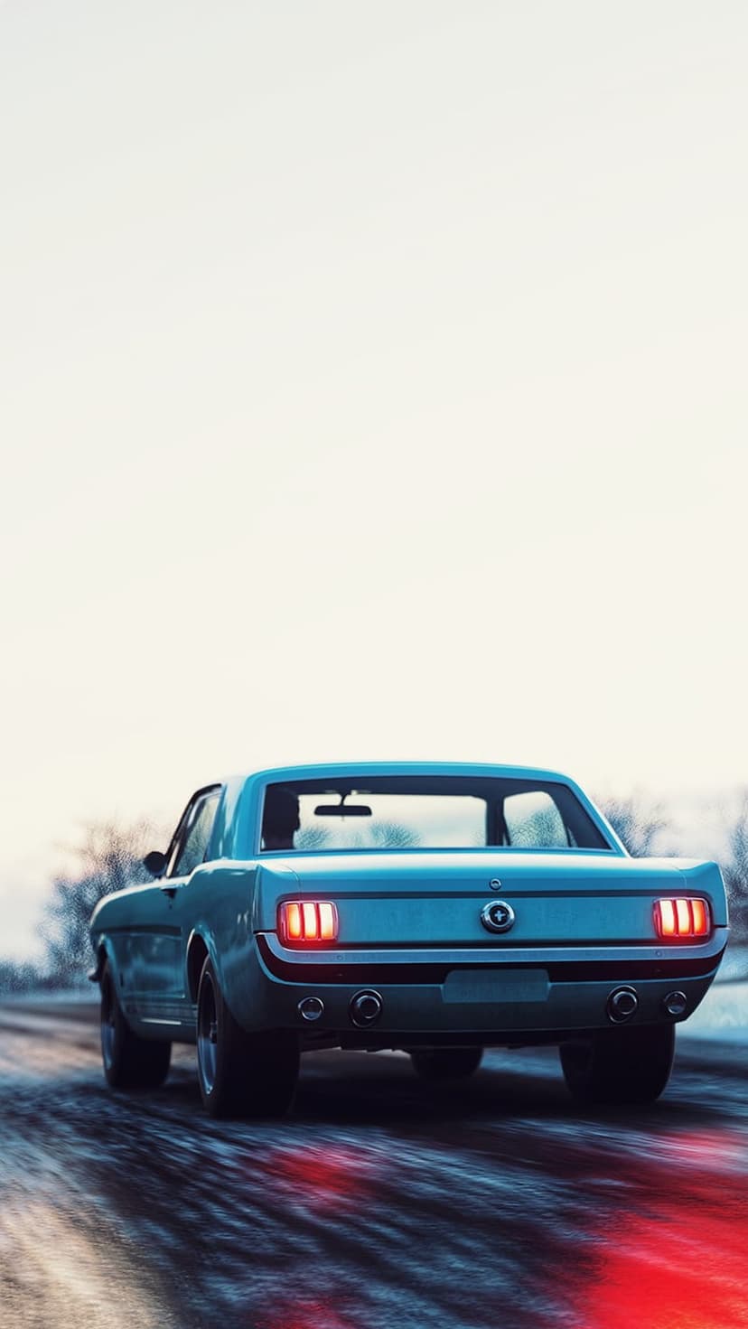Classic blue Ford Mustang driving away on a snowy road with glowing red brake lights under a hazy winter sky.