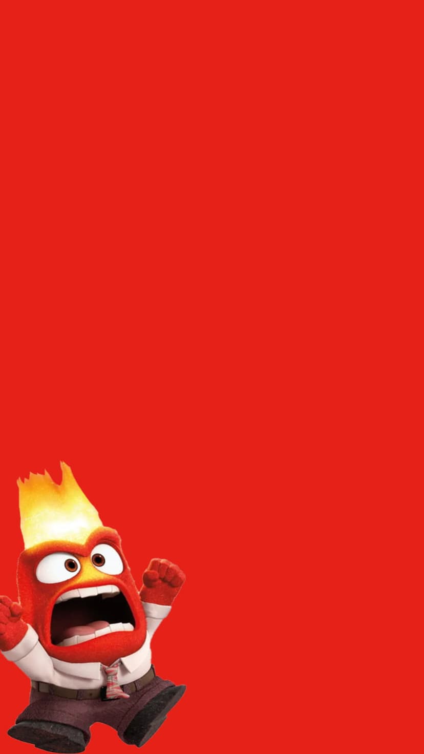 Anger from Inside Out stands with flaming hair and a clenched fist against a solid red studio background.
