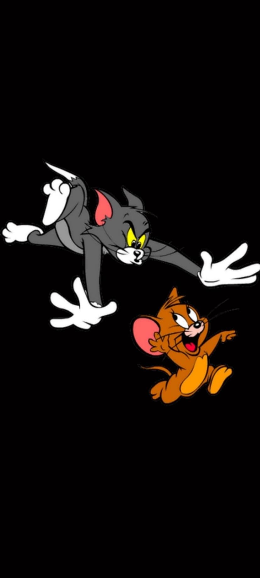 Tom the cat lunges at Jerry the mouse who smiles while running against a solid black background.