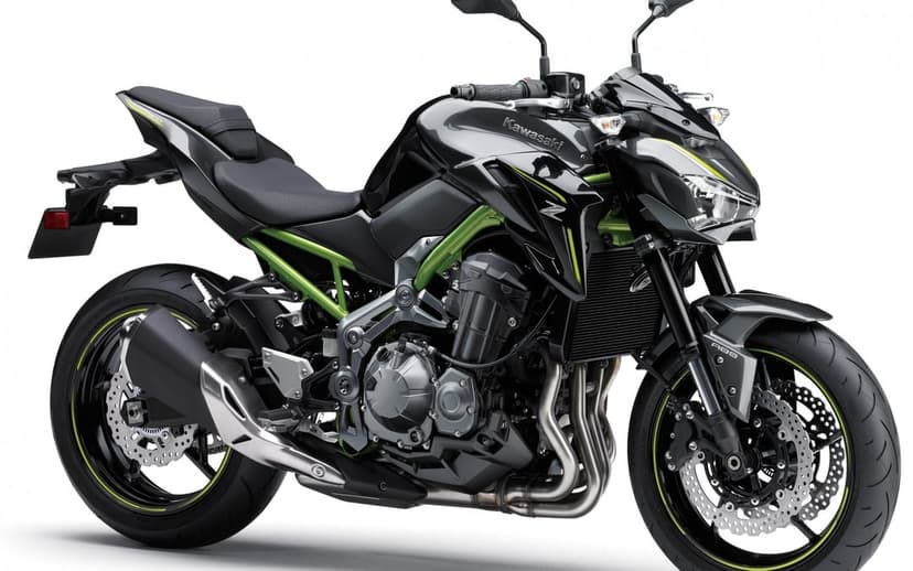 Kawasaki Z900 naked sportbike with lime green trellis frame and black bodywork on a minimalist white background.