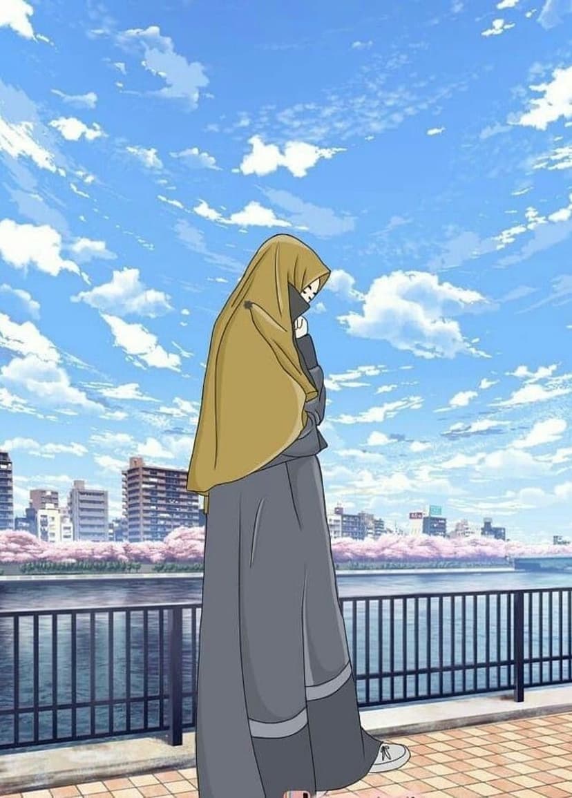 Young woman in a hijab standing by a river with pink cherry blossoms and a city skyline under a bright blue sky.