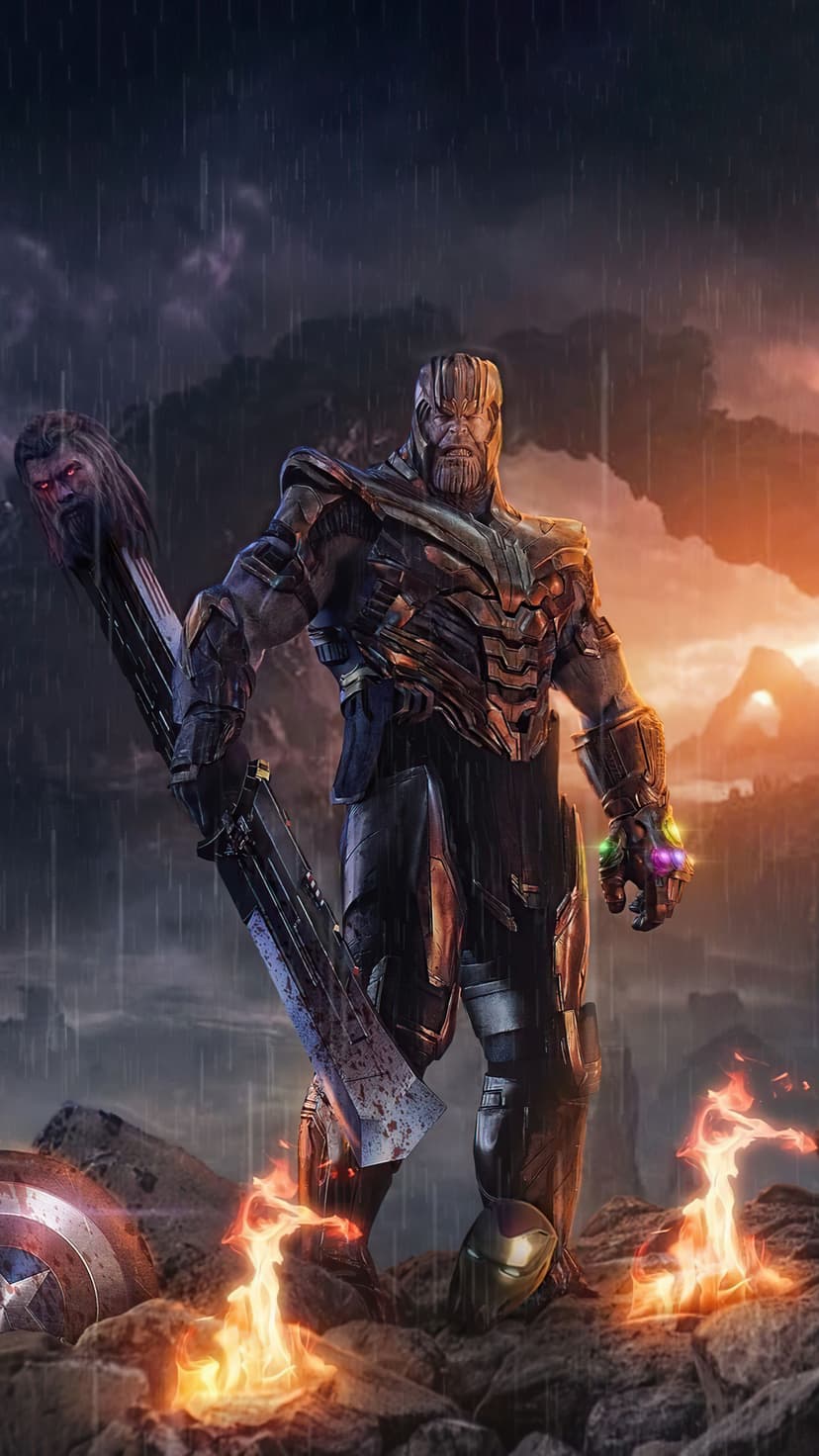 Thanos stands over a battlefield in the rain holding the Infinity Gauntlet and a severed head on Stormbreaker.