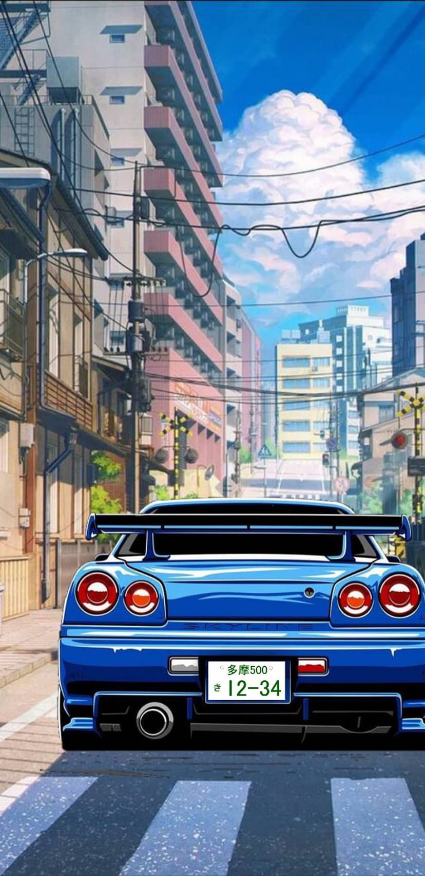 Blue Nissan Skyline GT-R with round taillights parked on a city street under a blue sky with white clouds.