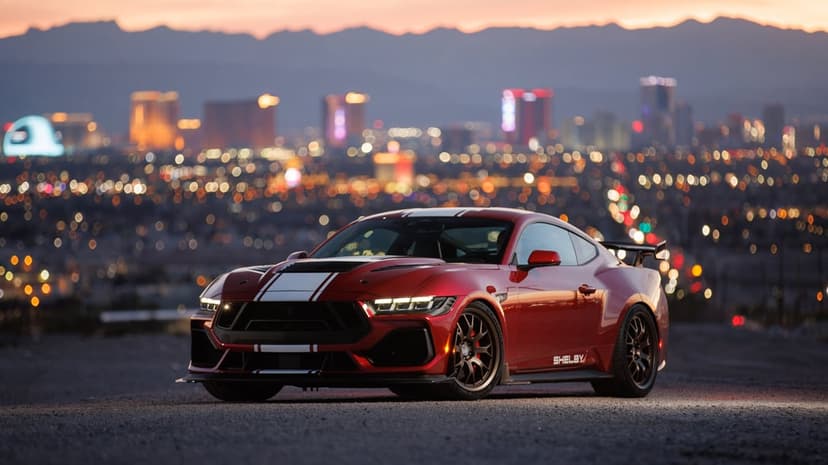 Shelby Super Snake performance car driving at high speed with realistic motion blur on a dark asphalt road.