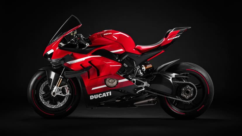 Red Ducati Superleggera V4 sportbike with carbon fiber wings against a solid black background in side profile.