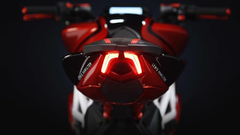 Rear view of a red MV Agusta motorcycle with a glowing LED taillight and Lewis Hamilton text on the side panels.