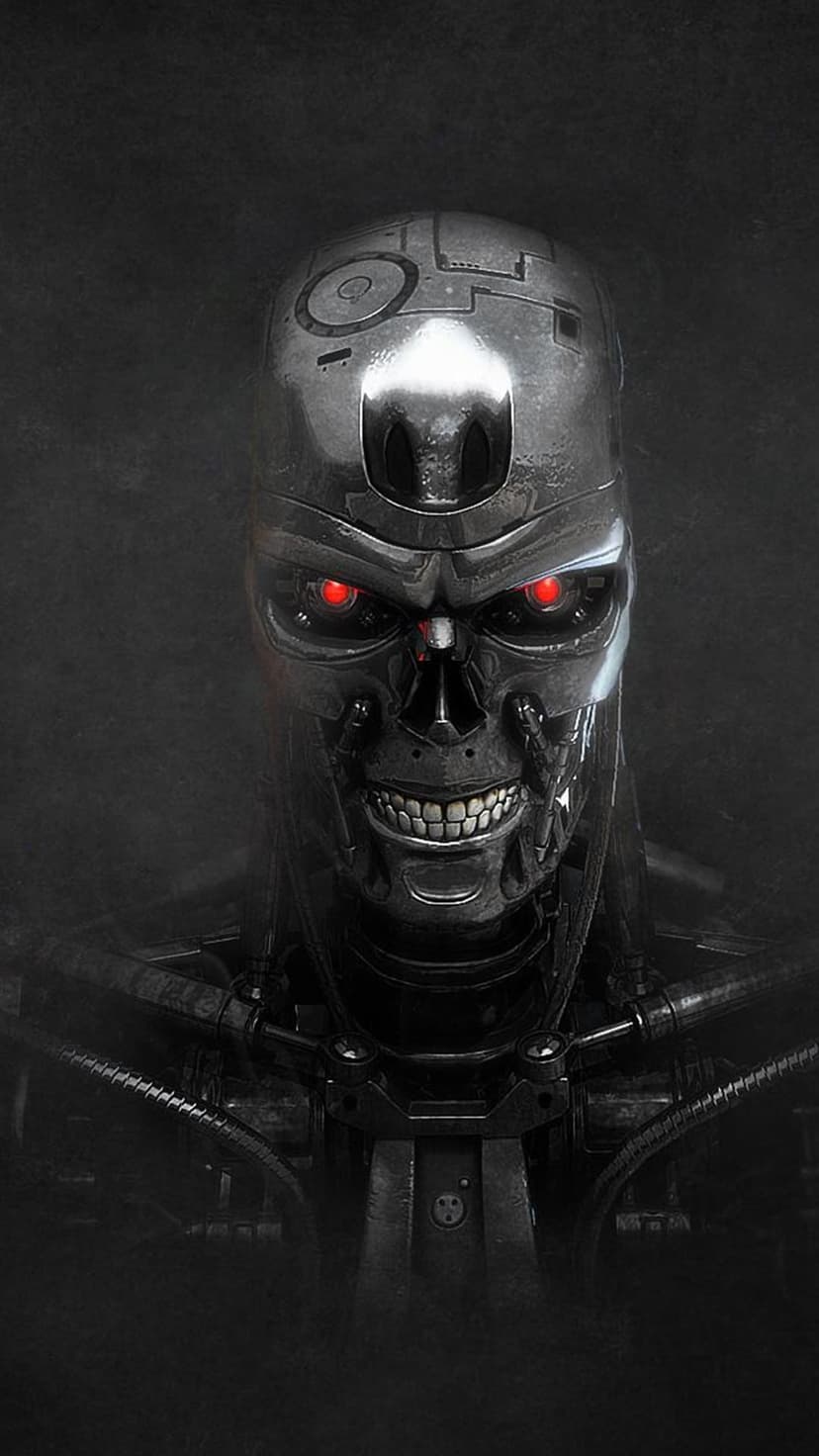 T-800 mechanical skull with glowing red eyes and polished chrome teeth set against a dark, shadowy background.