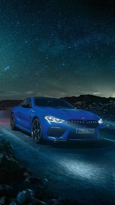 Blue BMW M8 Coupe Under Starry Night Sky