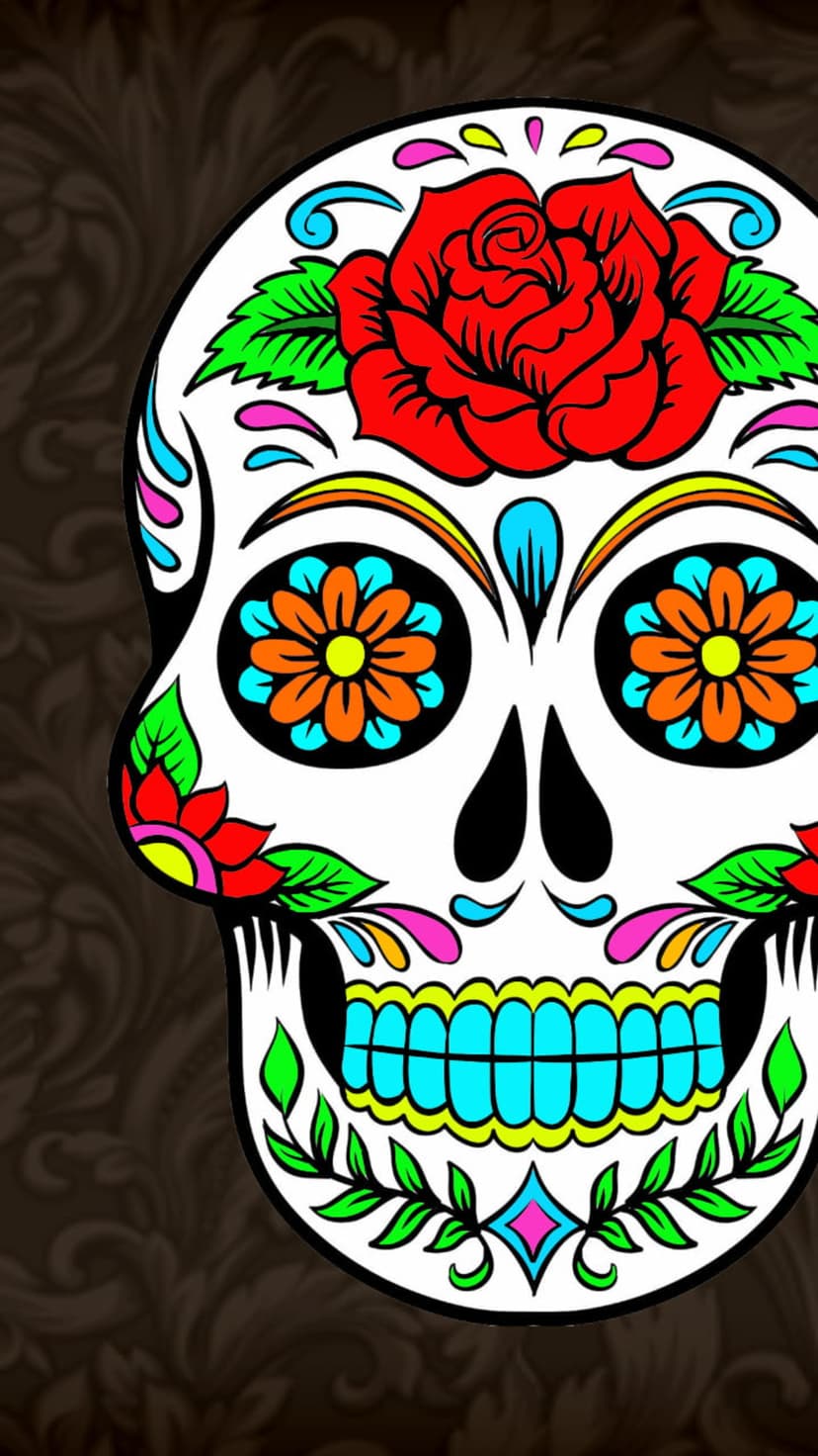 Sugar skull with a red rose crown and blue floral eye sockets surrounded by intricate yellow and pink patterns.