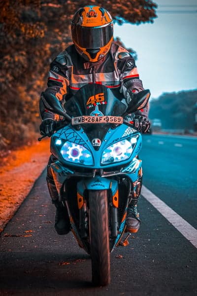 Rider on a blue Yamaha motorcycle on a scenic road