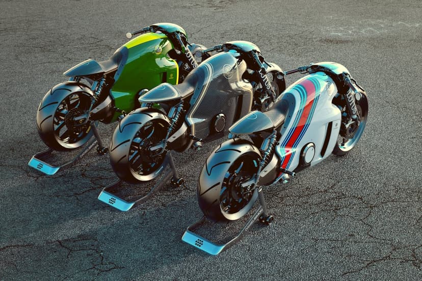 Three futuristic motorcycles with sleek aerodynamic bodies and specialized skids rest on a dark asphalt surface.