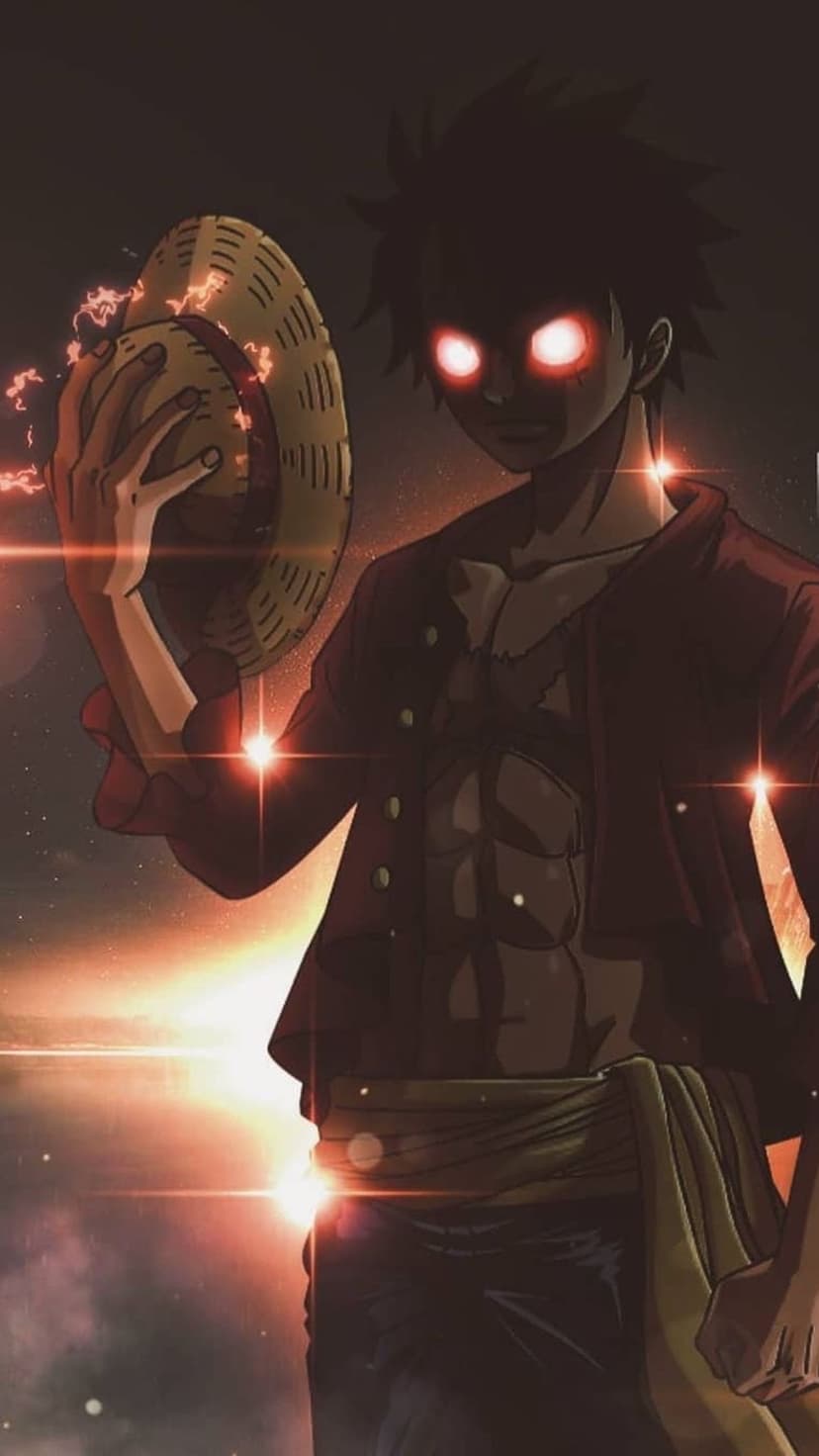 Monkey D. Luffy with glowing red eyes wearing a straw hat against a dark background with orange fire embers.