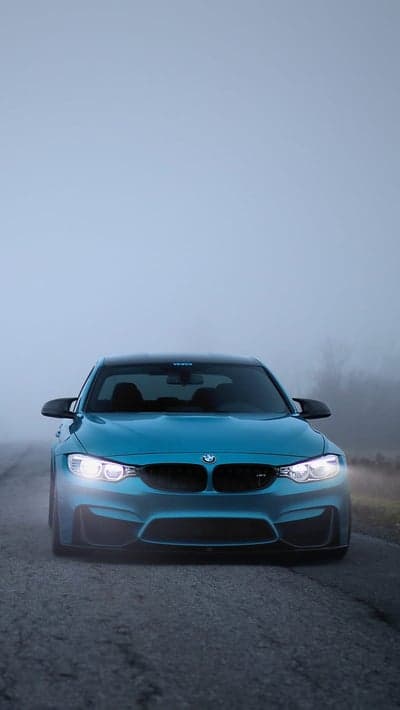 Blue BMW M4 in Foggy Morning Light