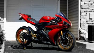 Red Yamaha R1 Superbike with Gold Wheels Desktop Wallpaper